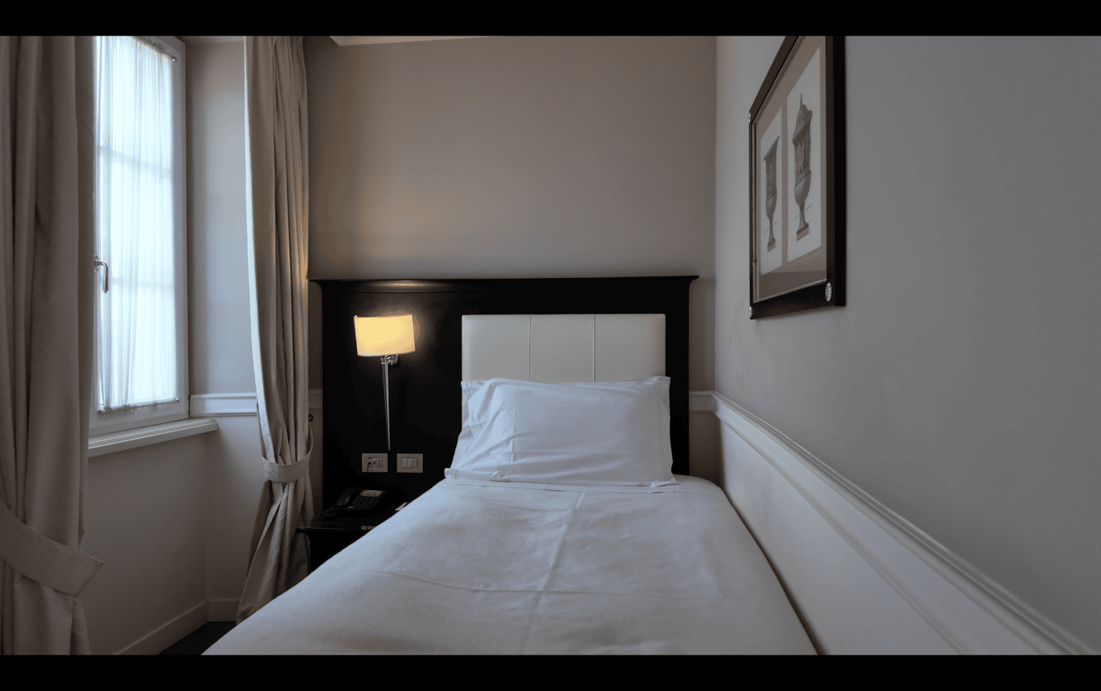 Room with muted warm tones at Victoria Hotel Letterario, Trieste